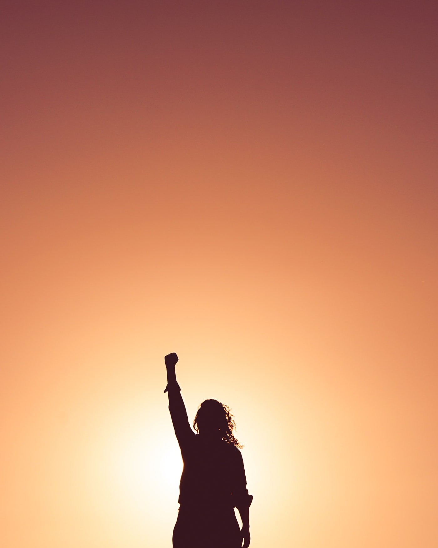 Woman holding hand up to the sky