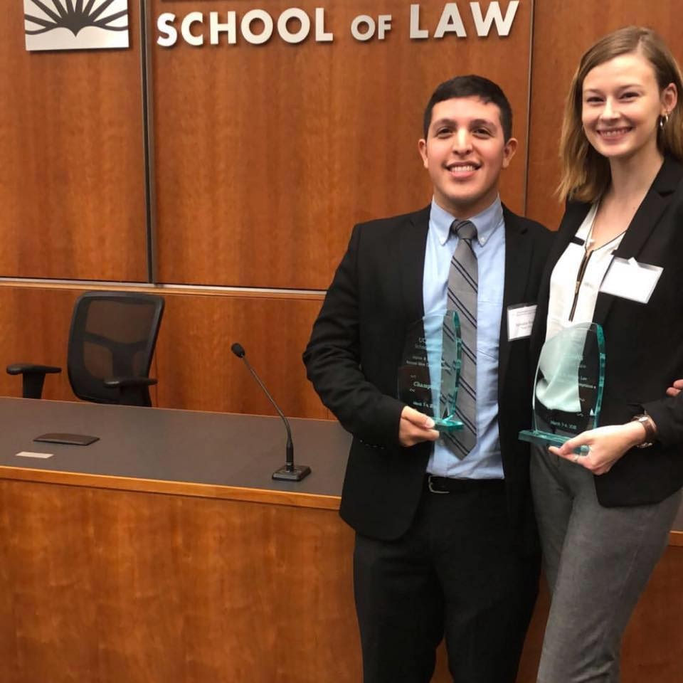 Sal Rosas '20 and Ellie Dupler '20 standing with their awards at UC Davis School of Law