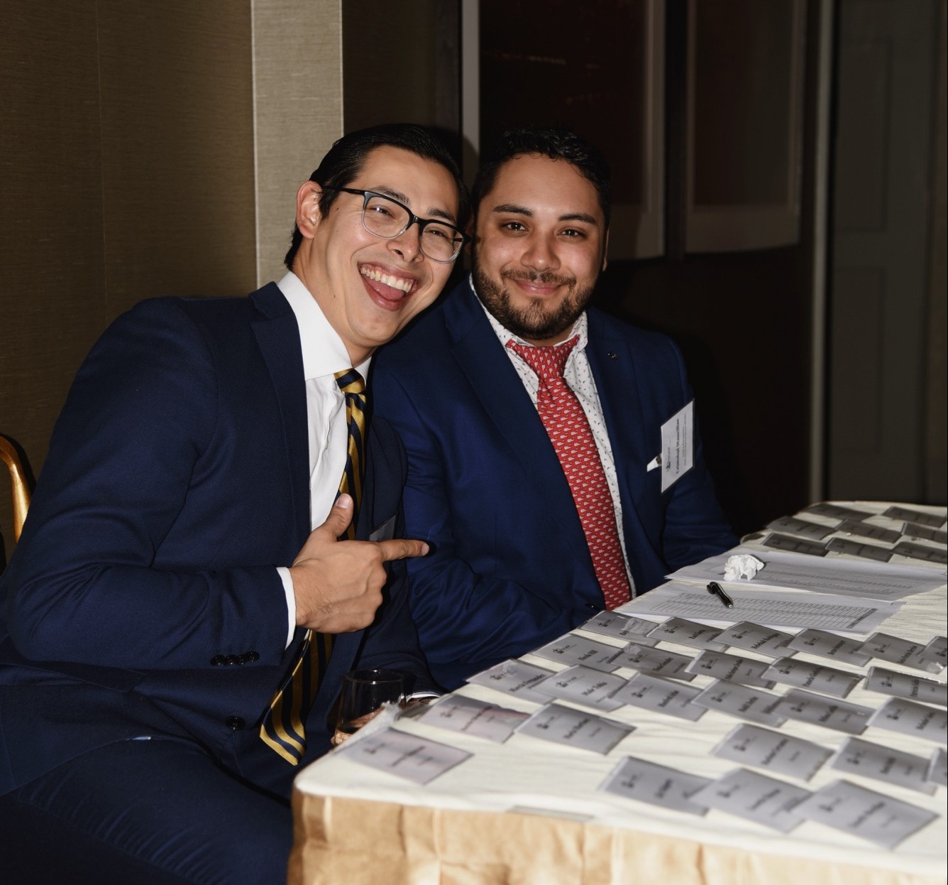 Nico Galvan and Cristobal Mancillas at the Check in table with guests' name tags